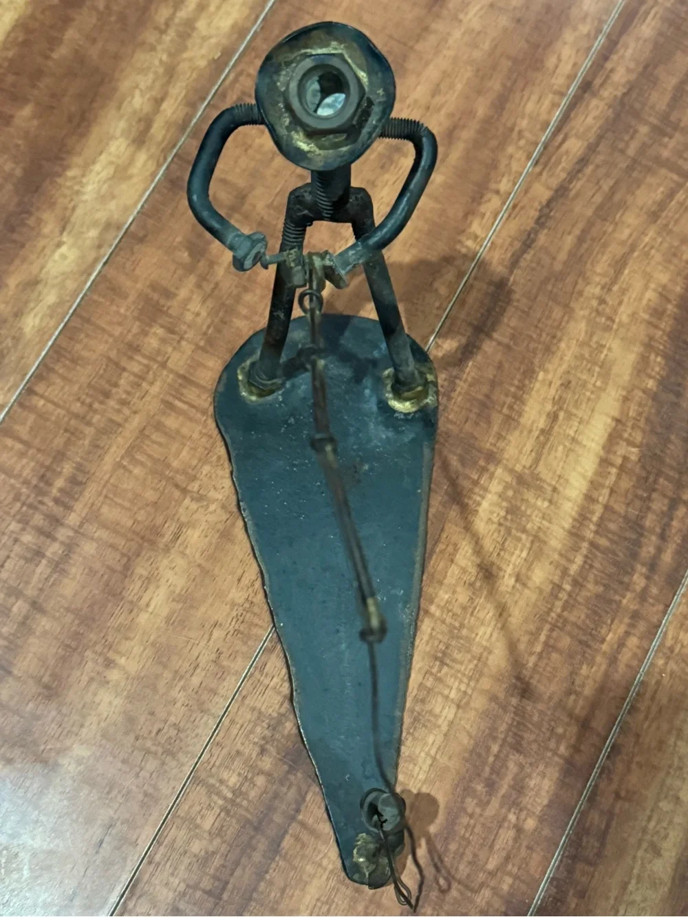 Industrial scrap metal sculpture fishing motif